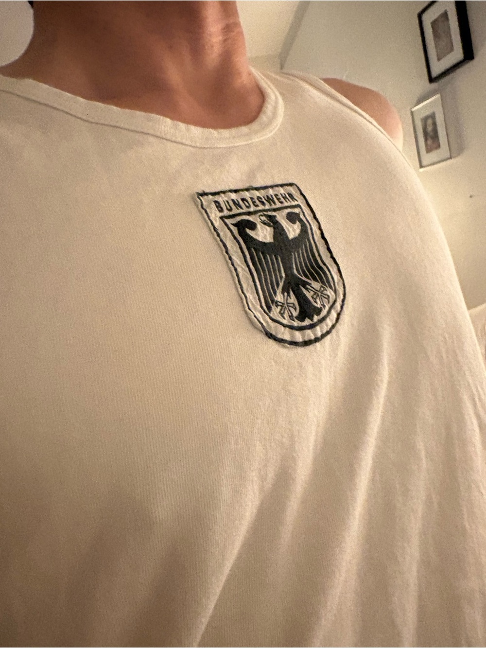 Tank top in White. Cotton. Embroidered black eagle crest.
